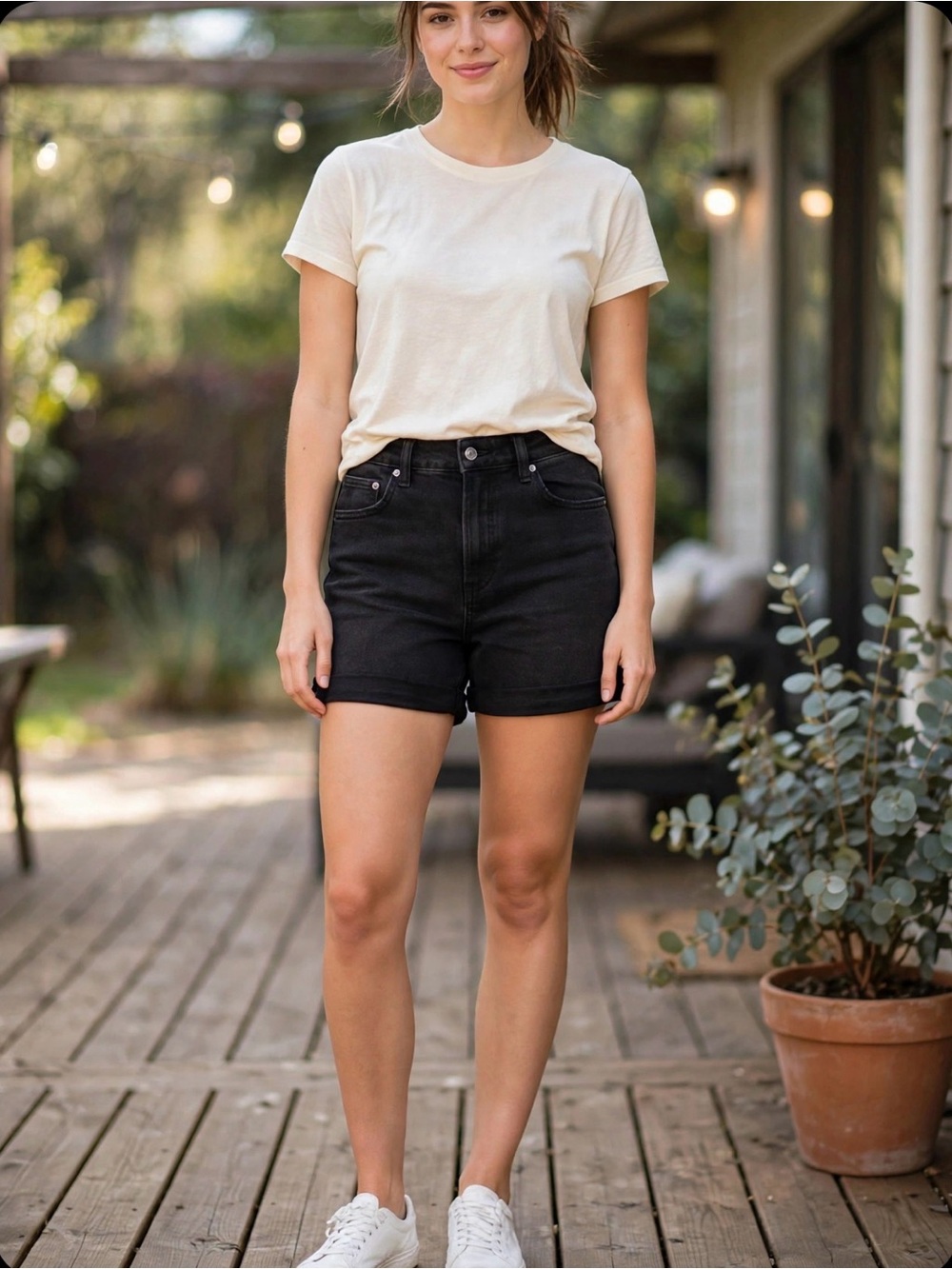 Black Tape high-waisted cuffed black denim short.